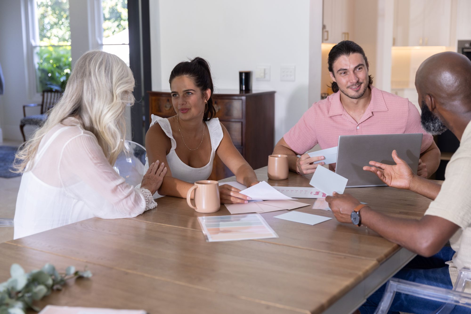 Multi-generational family discusses their options while seated around a table